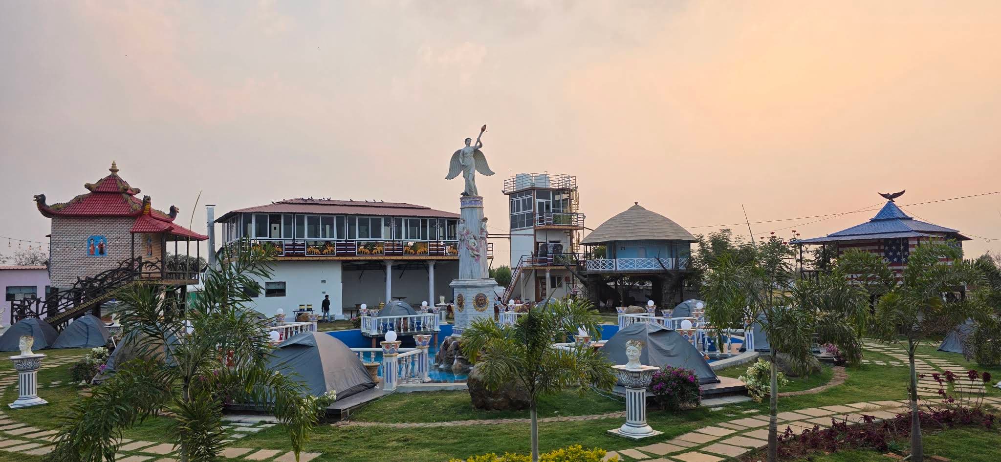 Heavens Luxury Lakeview Resort cottages, pool, and landscaped grounds at sunset